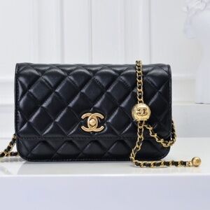 CHANEL Black Quilted Clutch with Gold Accents